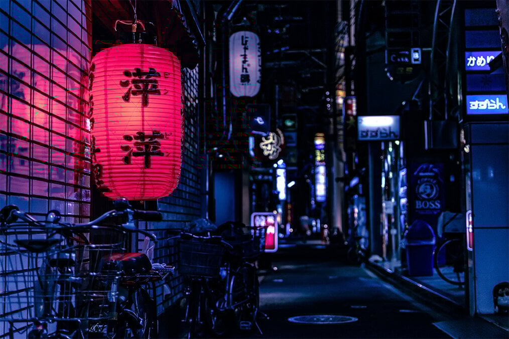 Photo via Unsplash A dark alley in Japan